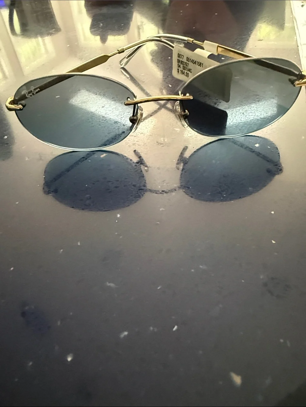 Ray-Ban Men’s Gold Frame Blue Lens Rimless Sunglasses - Oval